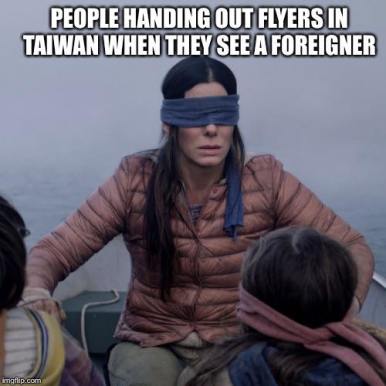 People handing out flyers in Taiwan when they see a foreigner